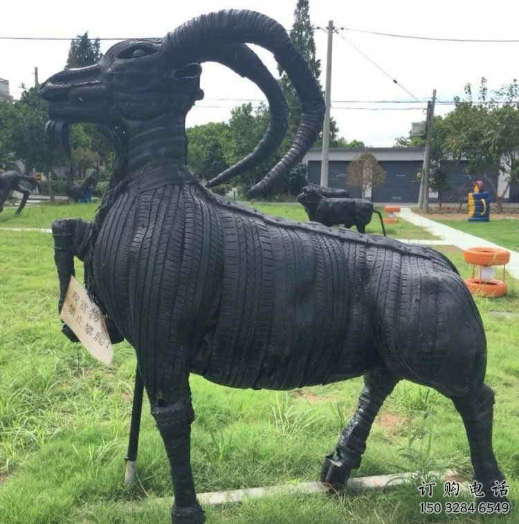 同心輪胎山羊雕塑供應(yīng)，公園雕塑，鑄銅輪胎羊雕塑供求